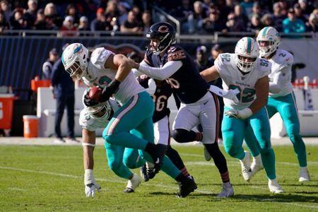 Miami Dolphins linebacker Andrew Van Ginkel (43) runs onto the field before  the start of an NFL football game against the Buffalo Bills, Sunday, Sept.  25, 2022, in Miami Gardens, Fla. (AP