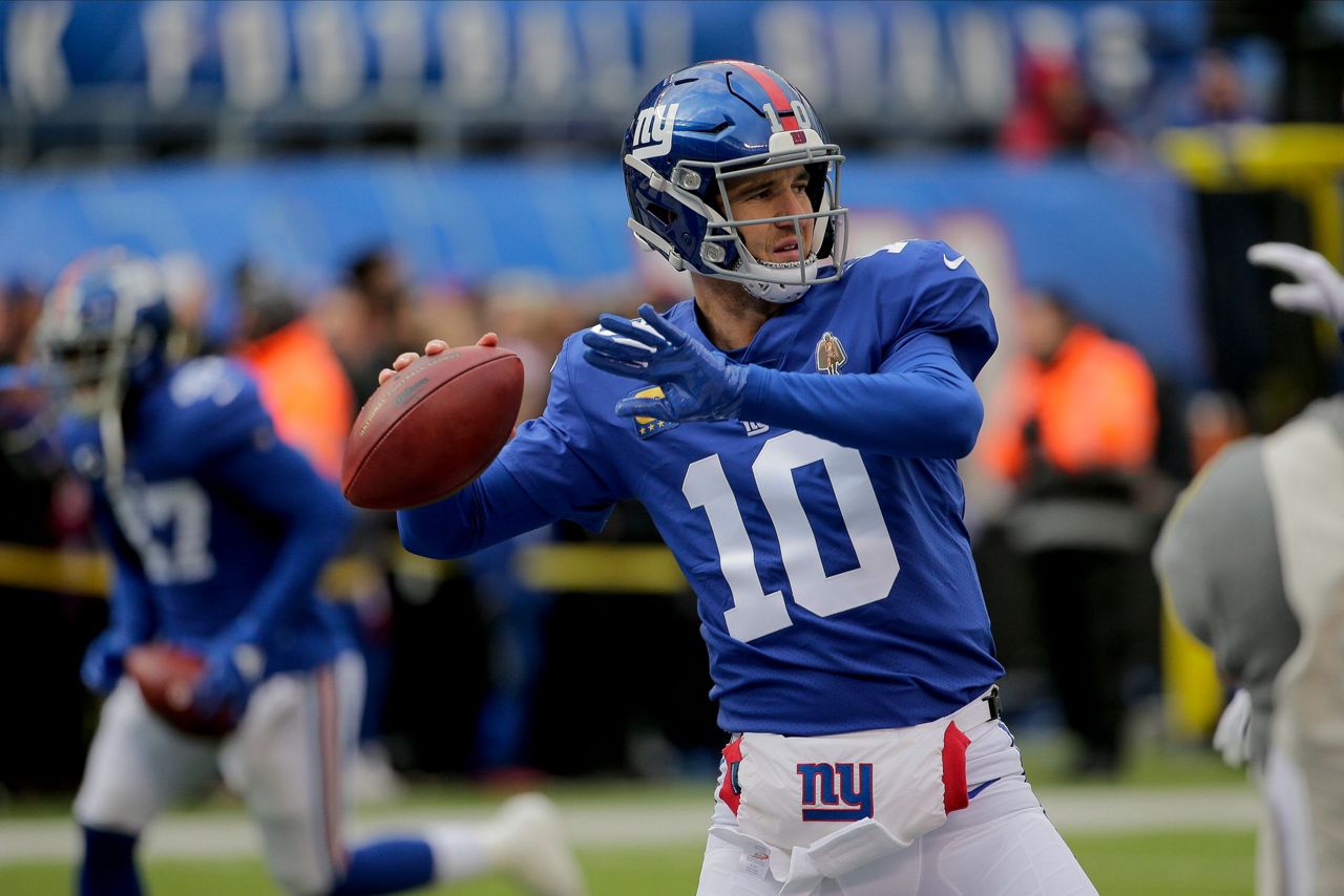 New York Giants quarterback Eli Manning throws a pass against the  Washington Redskins in the first