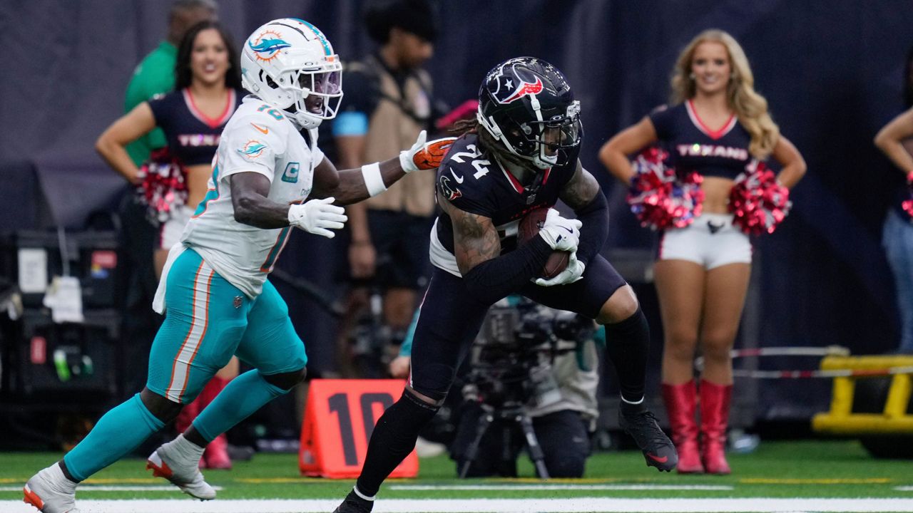 Houston Texans cornerback Derek Stingley Jr. (24) intercepts a pass intended for Miami Dolphins wide receiver Tyreek Hill (10) during the second half of an NFL football game Sunday, Dec. 15, 2024, in Houston. (AP Photo/Eric Christian Smith)