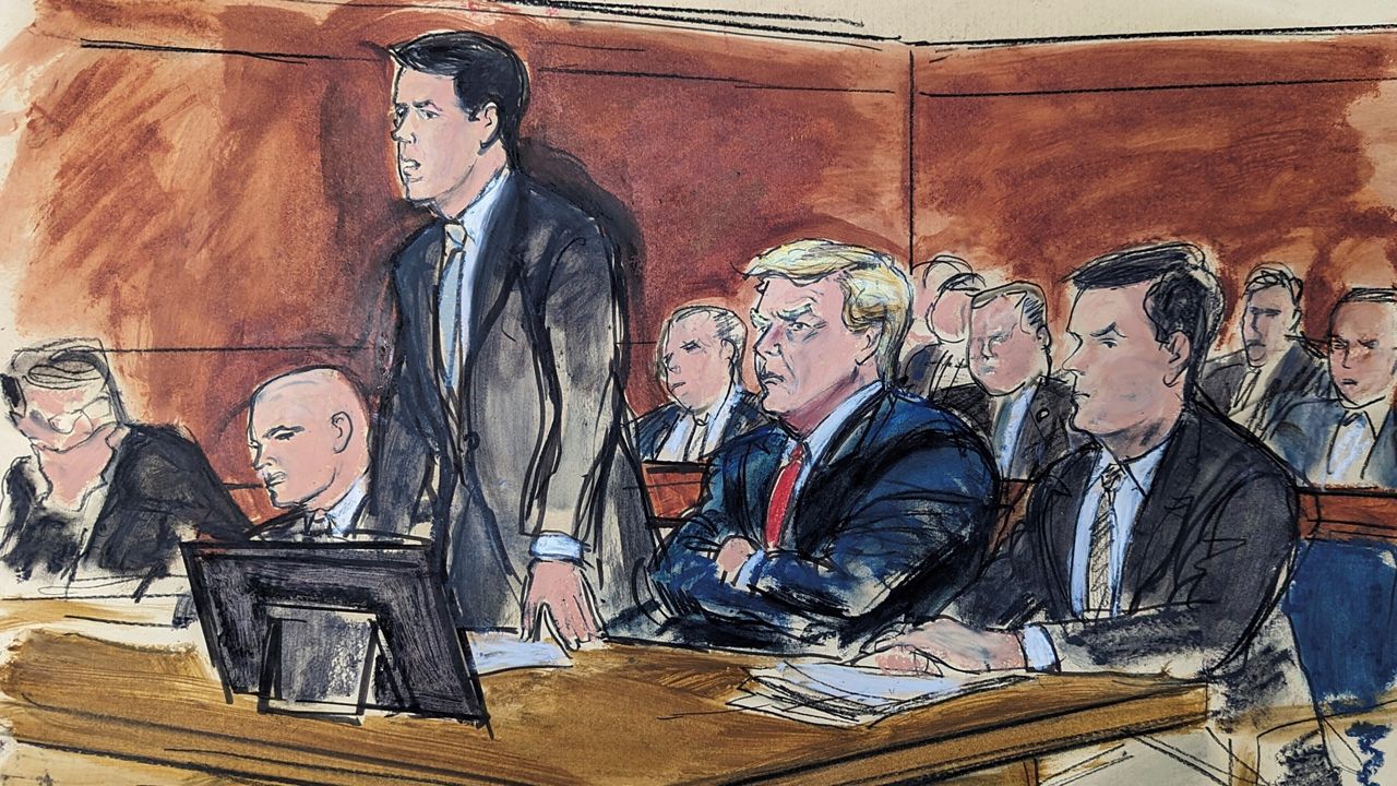 In this courtroom sketch, attorney Todd Blanche stands as he enters a plea of not guilty on behalf of former President Donald Trump, second from right, in federal court, Tuesday, June 13, 2023, in Miami. (Elizabeth Williams via AP)