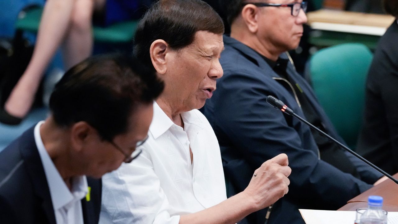 Former Philippine President Rodrigo Duterte gestures during a Senate investigation on the war on the drugs during his administration at the Philippine Senate, Monday, Oct. 28, 2024, in Manila, Philippines. (AP Photo/Aaron Favila)