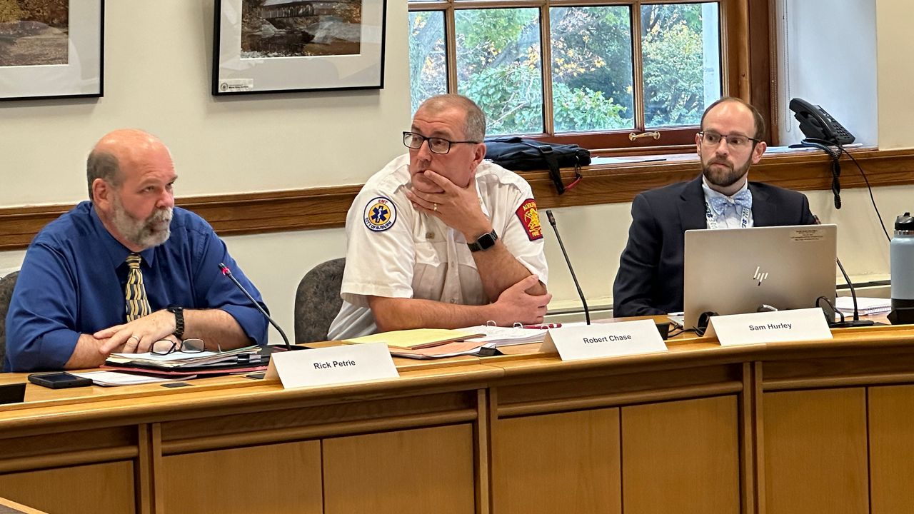 Rick Petrie, of North East Mobile Health Services, a for-profit ambulance service, Auburn Fire Chief Robert Chase and state EMS Director Sam Hurley are part of the new EMS commission that met Monday at the State House. (Spectrum News/Susan Cover)