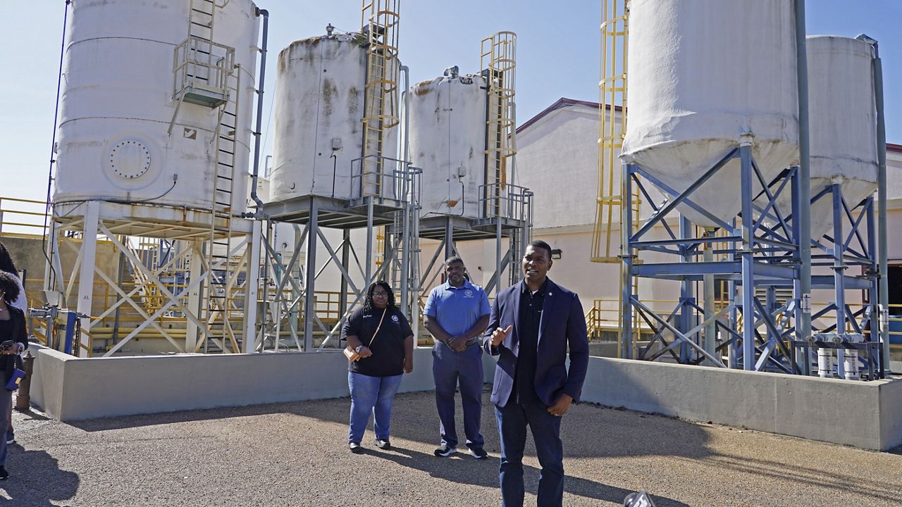 FILE - EPA Administrator Michael Regan, right, speaks to reporters at the O.B. Curtis Water Treatment Plant, a Ridgeland, Miss.-based facility near Jackson, Miss., about longstanding water issues that have plagued the city, Nov. 15, 2021. (AP Photo/Rogelio V. Solis, File)