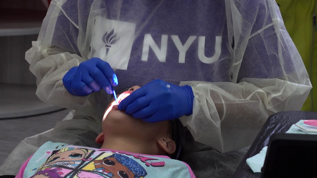 Students receive dental exams at school