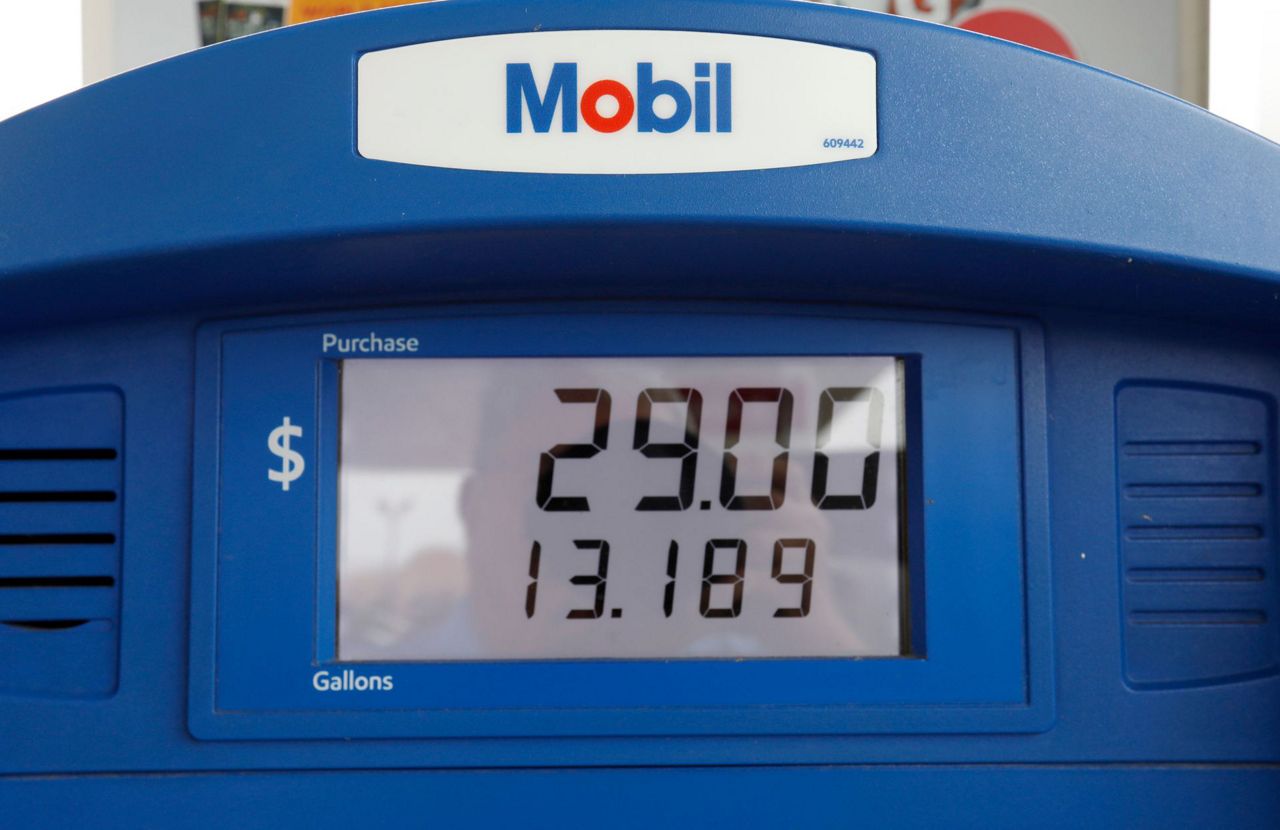 Exxon Mobil profit falls as oil and gas prices decline