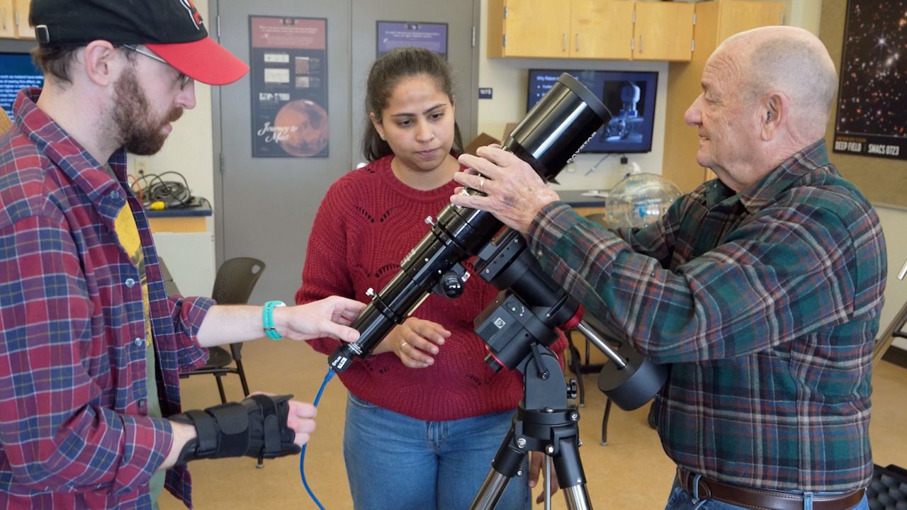 Students and scientists at the University of Maine at Orono work with a special telescope and camera for viewing the total solar eclipse predicted to happen next month. Scientists hope to glean valuable data about solar flares from the phenomenon. (University of Maine at Orono)