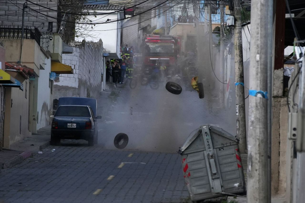 Violence rattles Ecuador as a arson kills 2 and a bomb scare sparks an evacuation