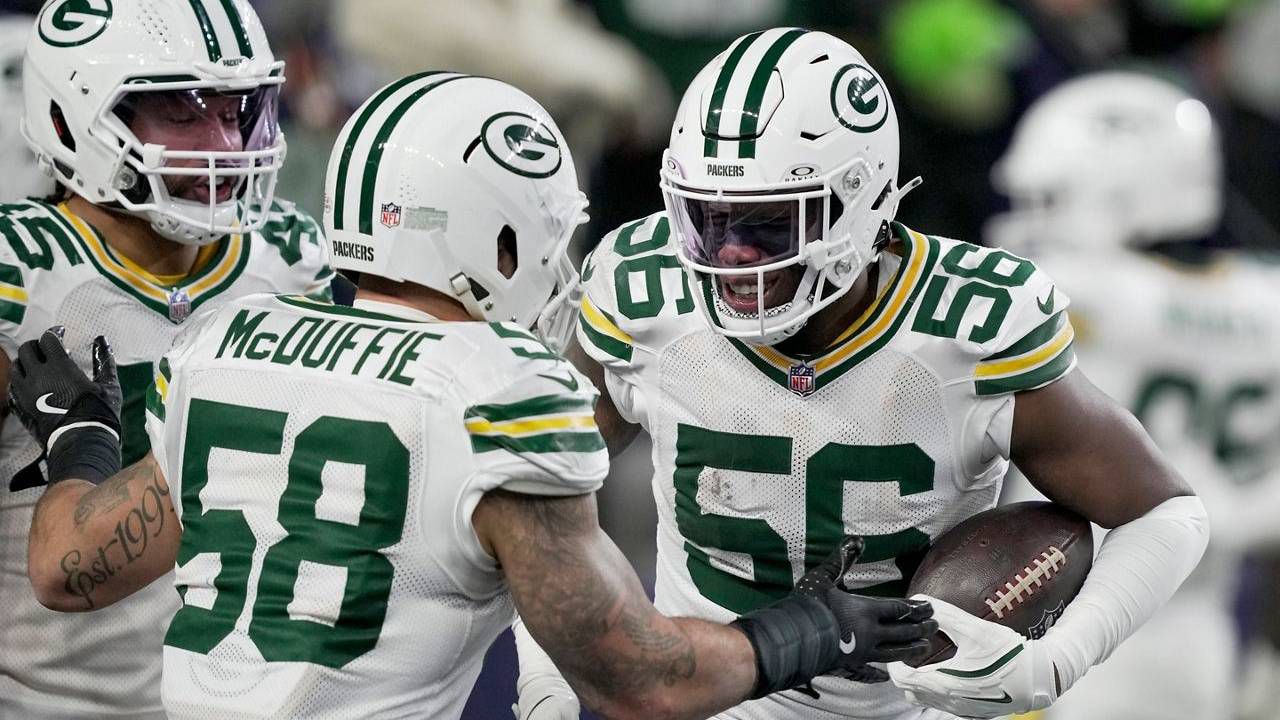 Green Bay Packers' Edgerrin Cooper is congratulated after an interception 