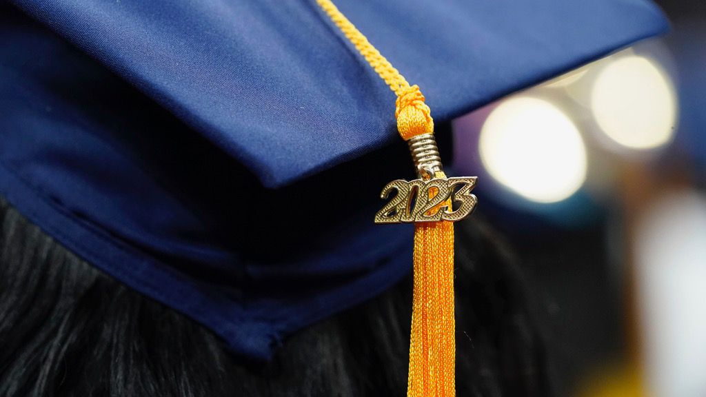 A tassel with 2023 on it rests on a graduation cap as students walk in a procession for Howard University's commencement in Washington, Saturday, May 13, 2023. (AP Photo/Alex Brandon)