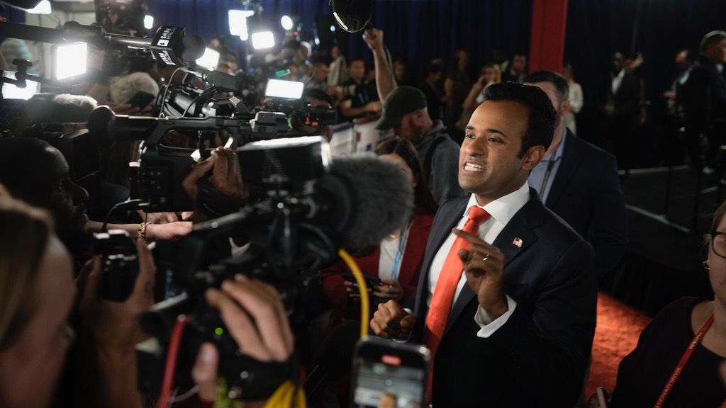 Businessman Vivek Ramaswamy talks with reporters in the spin room after a Republican presidential primary debate hosted by FOX News Channel Wednesday, Aug. 23, 2023, in Milwaukee. (AP Photo/Morry Gash)