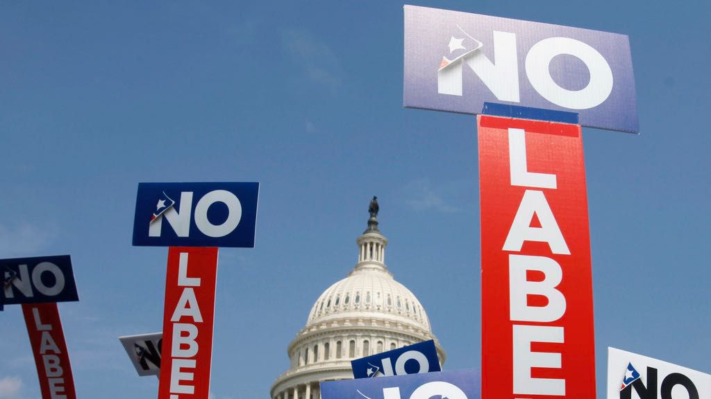 People with the group No Labels hold signs during a rally on Capitol Hill in Washington, July 13, 2013. (AP Photo/Jacquelyn Martin, File)