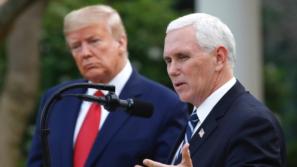 President Donald Trump listens as Vice President Mike Pence speaks during a coronavirus task force briefing in the Rose Garden of the White House, Sunday, March 29, 2020, in Washington. (AP Photo/Patrick Semansky, File)