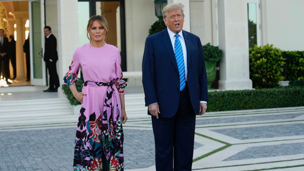 Donald Trump stands with Melania Trump as they arrive for a fundraiser on Saturday, April 6, 2024 in Palm Beach.