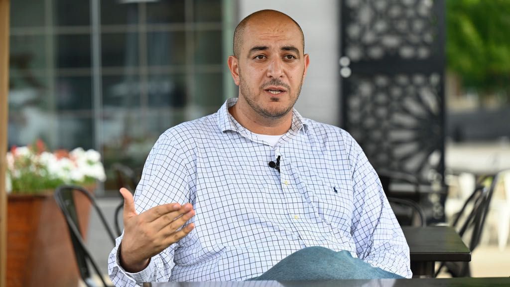 Uncommitted delegate to the Democratic National Convention Abbas Alawieh answers questions during an interview Wednesday, Aug. 14, 2024, in Dearborn, Mich. (AP Photo/Jose Juarez)