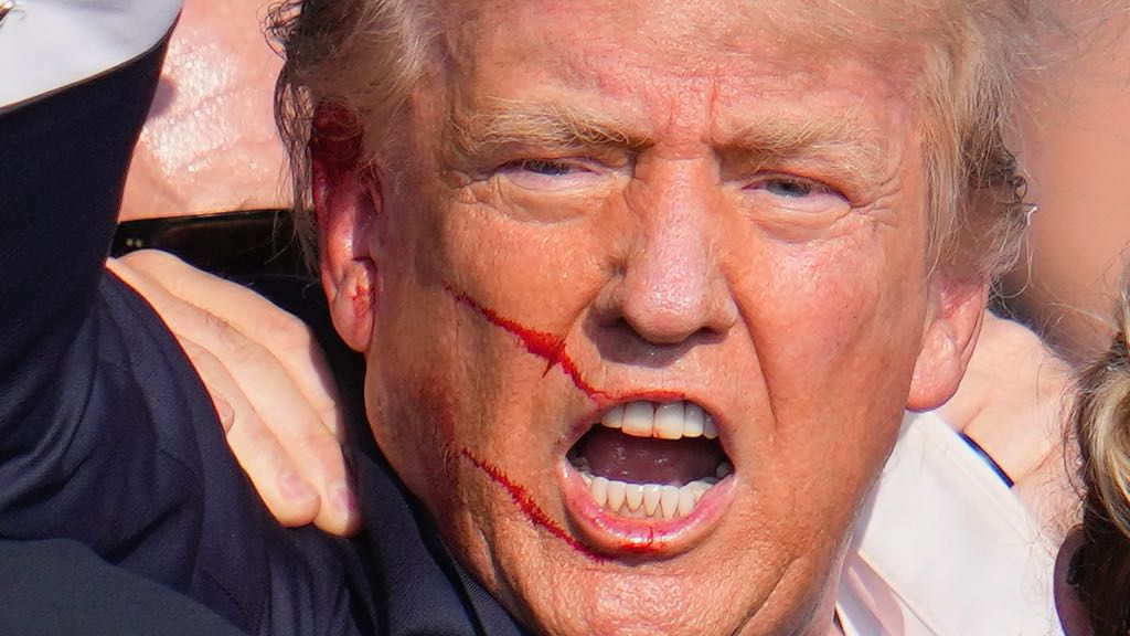 Republican presidential candidate former President Donald Trump reacts following an assassination attempt at a campaign event in Butler, Pa., on Saturday, July 13, 2024. (AP Photo/Gene J. Puskar)