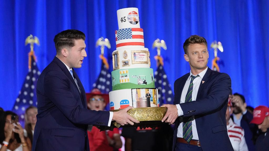 A birthday cake is carried onto the stage before Republican presidential candidate former President Donald Trump speaks at his birthday celebration, hosted by Club 47, in West Palm Beach, Fla., Friday, June 14, 2024. (AP Photo/Gerald Herbert)
