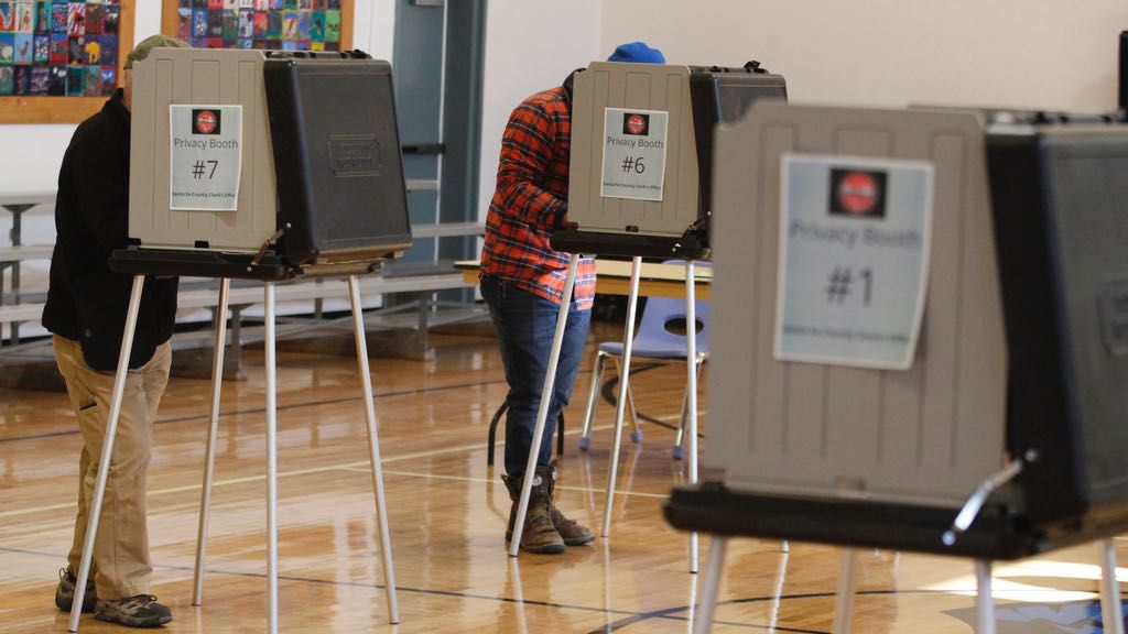 Voters fill out ballots at an elementary school in Tesuque, N.M., on Tuesday, Nov. 8, 2022.