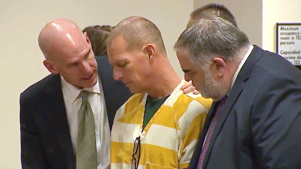 Lawyers console paramedic Peter Cichuniec after his sentence is read, March 1, 2024, in Brighton, Colo. (Colorado State Court via AP, Pool, File)