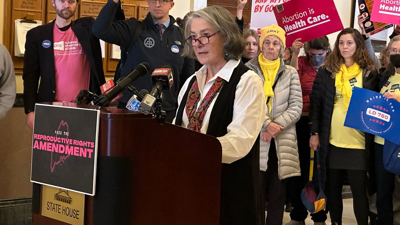 Senate Majority Leader Eloise Vitelli (D-Arrowsic) speaks in front of supporters of a constitutional amendment to enshrine the right to an abortion in the state constitution on Monday at the State House. (Spectrum News/Susan Cover)