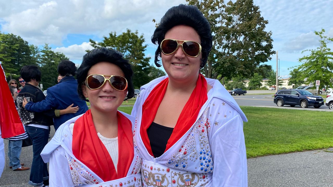 Braelyn Skidgel, 11, and Brittney Lucas, 30, of Chelsea, came to the Augusta Civic Center Tuesday dressed as Elvis to try to help break the Guinness World Record for Elvis impersonators in one place. (Spectrum News/Susan Cover)