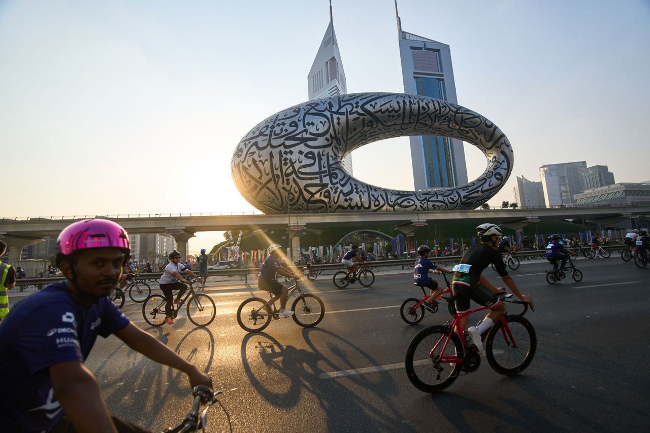 Thousands of bicycles take over Dubai's busiest highway as part of a ...