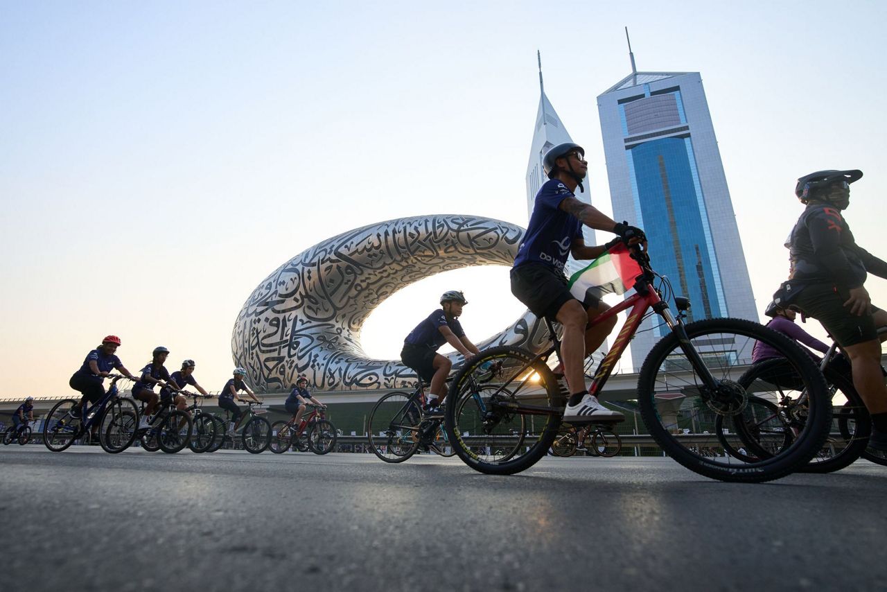 Thousands of bicycles take over Dubai's busiest highway as part of a ...