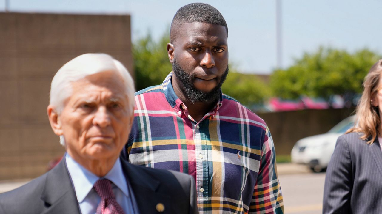 Emmitt Martin III, a former Memphis Police Department officer, center, accused of killing Tyre Nichols, walks into federal court Friday, Aug. 23, 2024, in Memphis, Tenn. (AP Photo/George Walker IV, File)