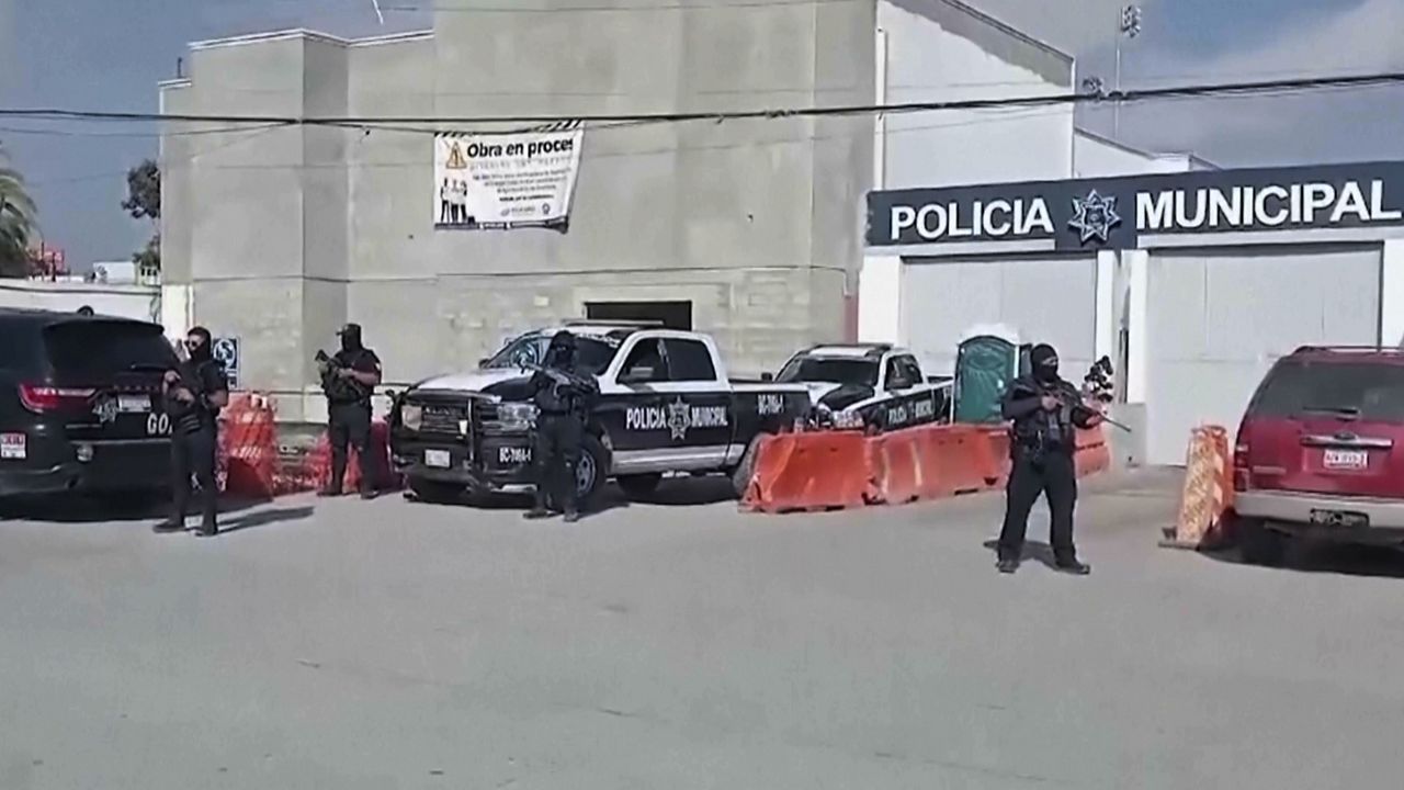 In this image made from video, Mexico's police officers stand guard at the Ensenada station in Ensenada, Mexico, Thursday, May 2, 2024. (AP Photo)
