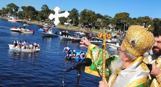 The throwing of the cross symbolizes casting of the bread of truth upon the trouble world. The plunging of the young boys into the waters signifies Jesus' going into the river Jordan. (Spectrum Bay News 9 file)