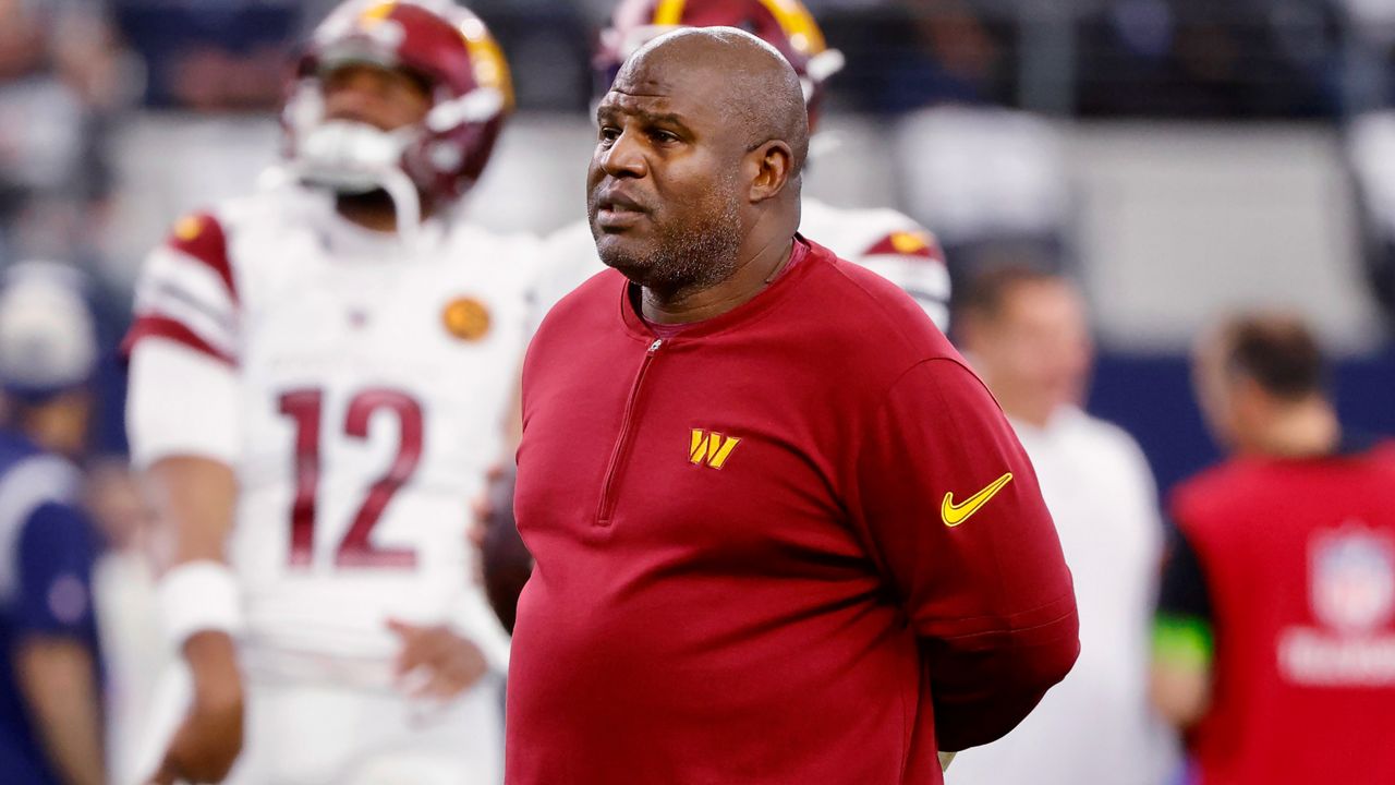 Washington Commanders offensive coordinator Eric Bieniemy watches players warm up for an NFL football game against the Dallas Cowboys, Nov. 23, 2023, in Arlington, Texas. Bieniemy is on the verge of returning home for his next job. The former Kansas City Chiefs and Commanders offensive coordinator is expected to become UCLA’s associate head coach and offensive coordinator, two persons familiar with the situation told The Associated Press. (AP Photo/Michael Ainsworth, File)