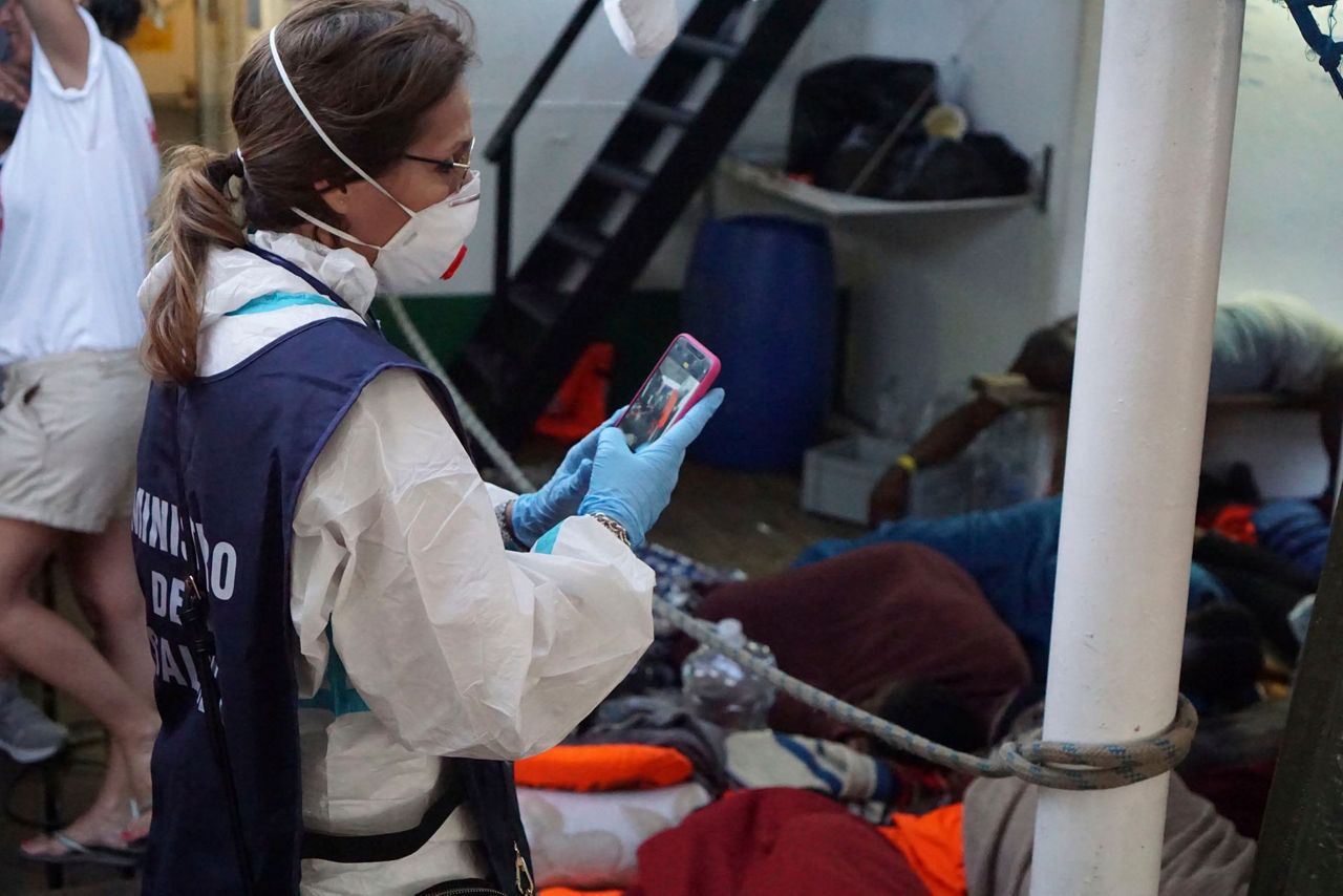 The Latest: Migrants jump into sea from Spanish rescue boat
