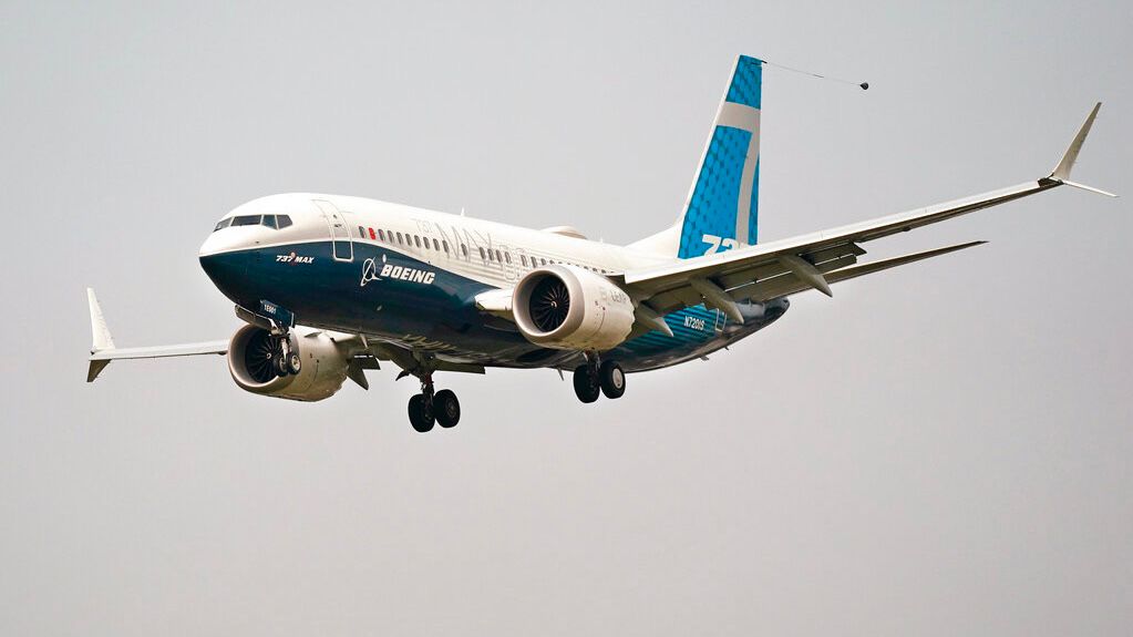 In this Wednesday, Sept. 30, 2020, file photo, a Boeing 737 Max jet, piloted by Federal Aviation Administration Chief Steve Dickson, prepares to land at Boeing Field following a test flight in Seattle. (AP Photo/Elaine Thompson)
