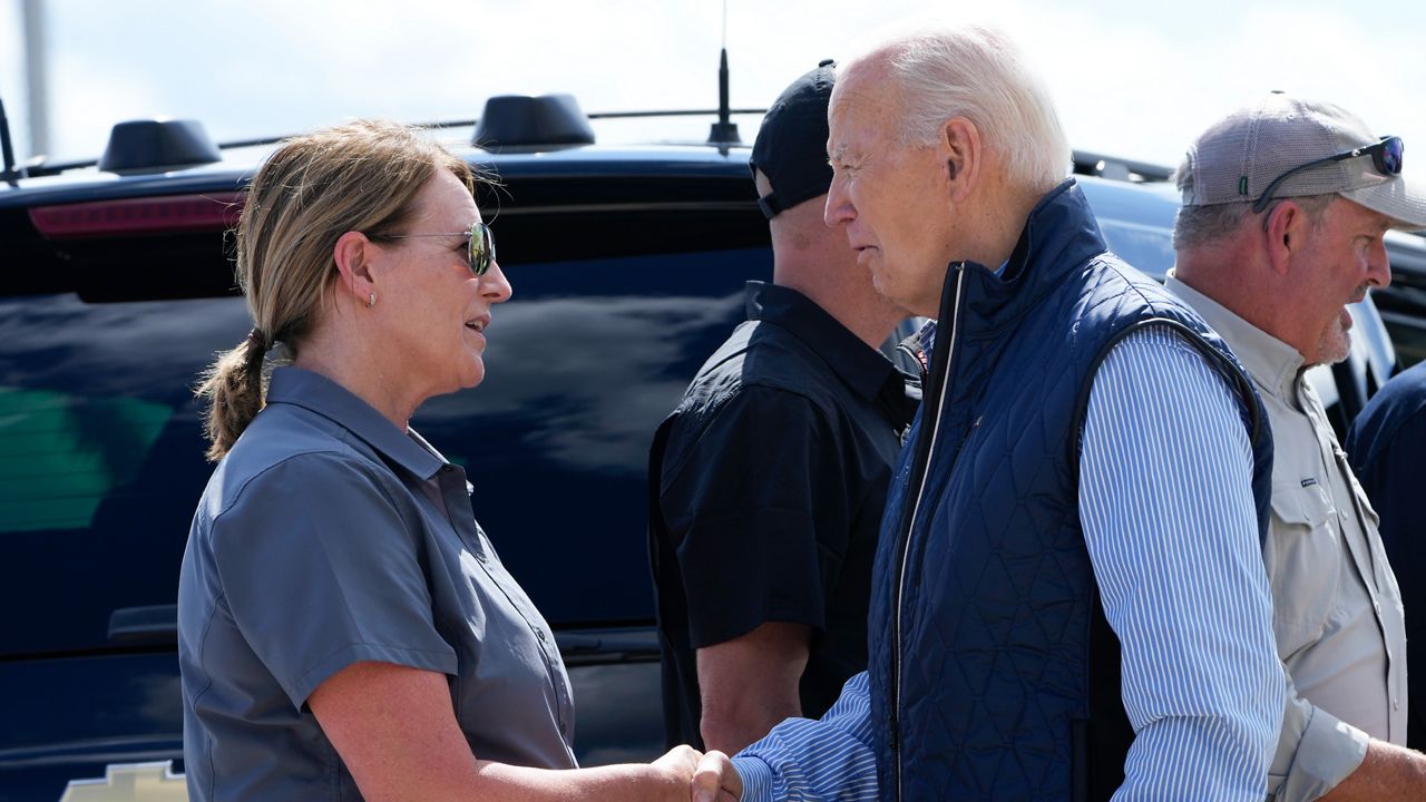 President Joe Biden talks with Deanne Criswell, Administrator of the Federal Emergency Management Agency (FEMA), as he arrives at Greenville-Spartanburg International Airport in Greer, S.C., Wednesday, Oct. 2, 2024, to survey damage from Hurricane Helene. (AP Photo/Susan Walsh)