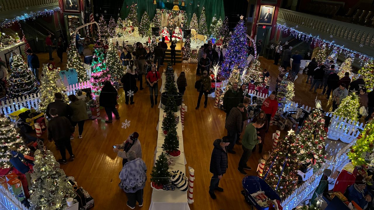 People look at the display trees at the Kora Shriners temple on Sunday, Nov. 24. (Spectrum News/Matthew Jaroncyk)