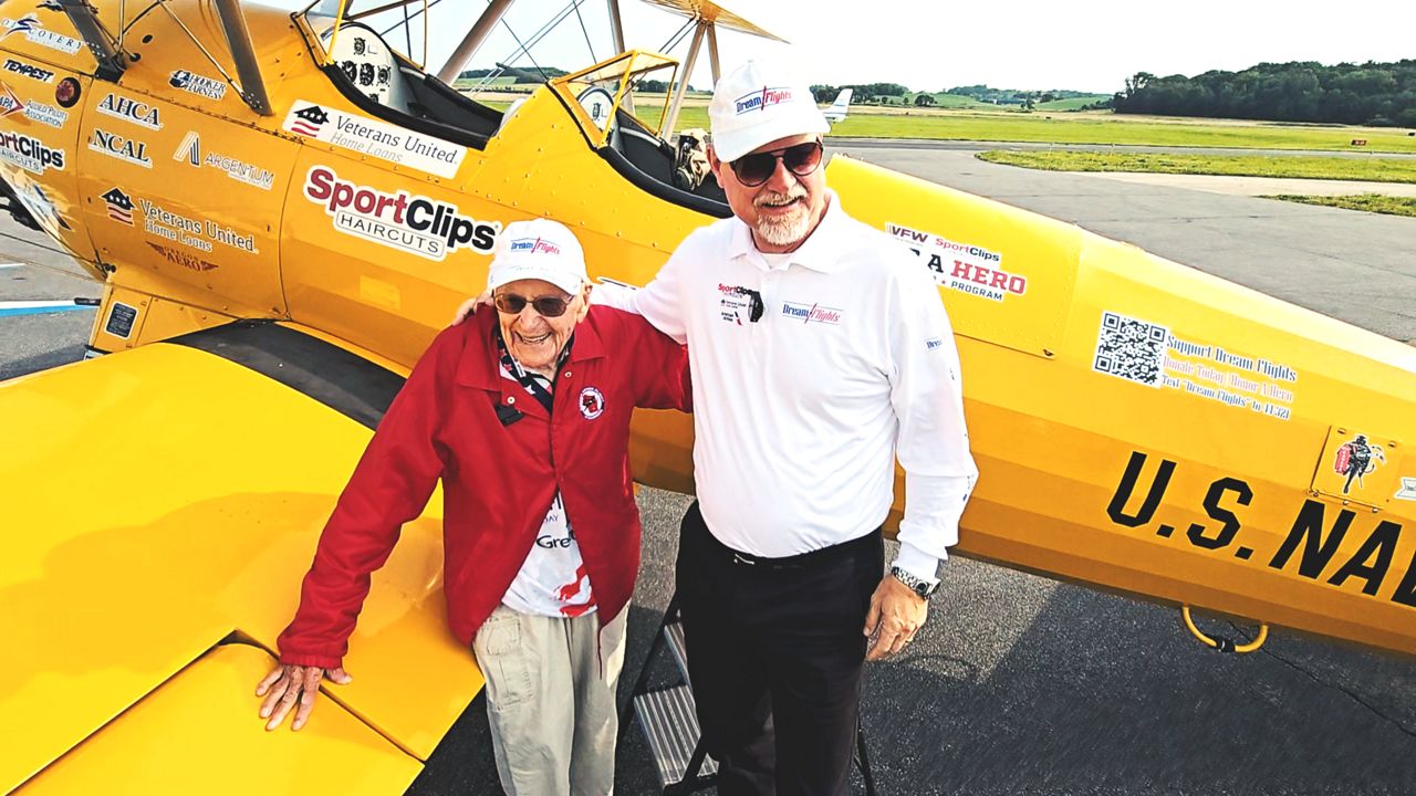 Veteran celebrates 100th birthday with biplane flight