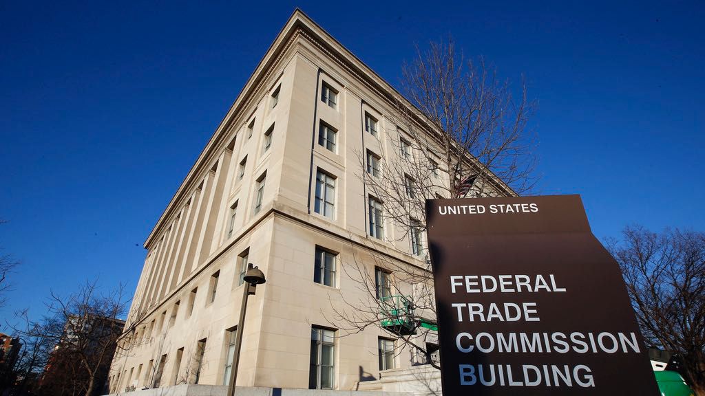 The Federal Trade Commission building is seen, Jan. 28, 2015, in Washington. U.S. companies would no longer be able to bar employees from taking jobs with competitors under a rule approved by the FTC on Tuesday, April 23, 2024, though the rule seems sure to be challenged in court. (AP Photo/Alex Brandon, File)