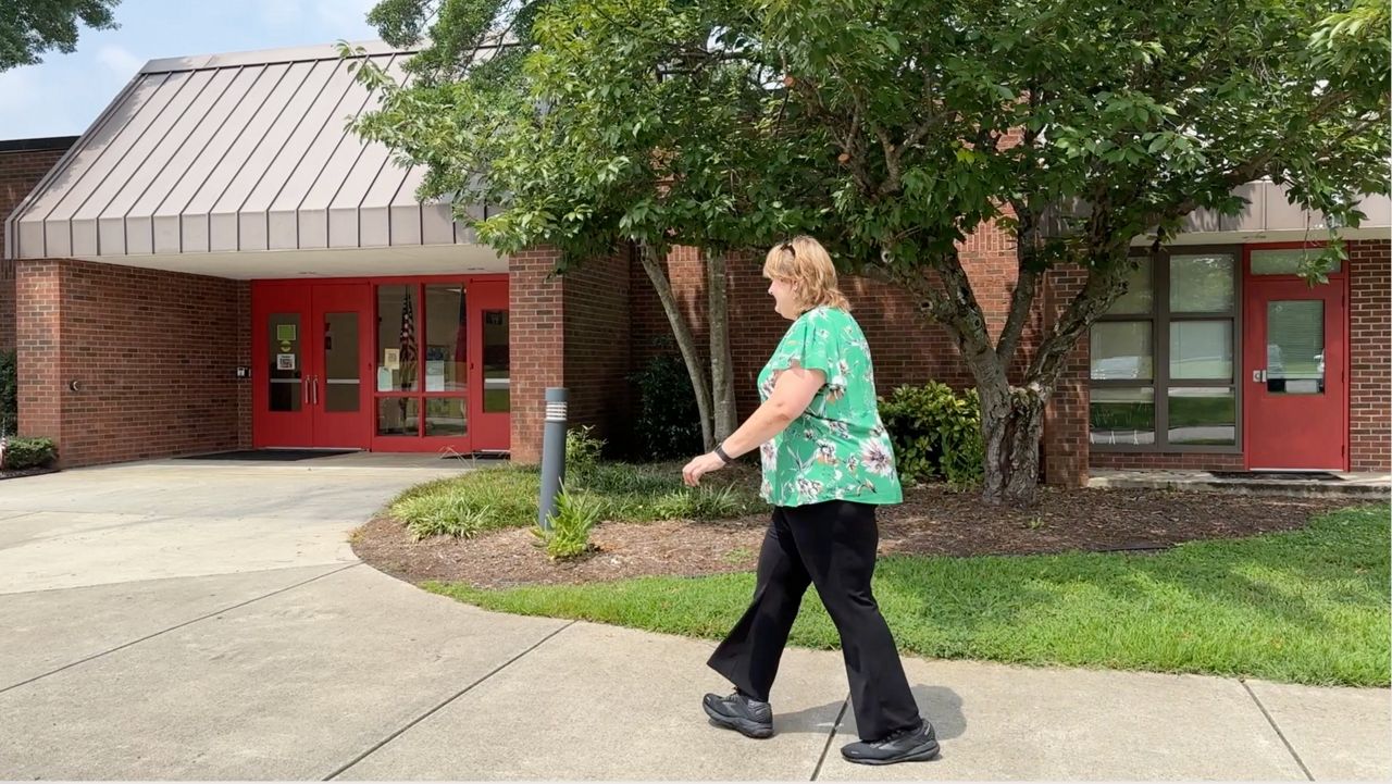 Teacher Christy Brown walks the campus at Fuquay-Varina Elementary School. (Spectrum News 1/Josh Conner)