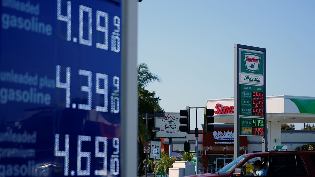 A sign at a Sinclair gas station is seen next to an Arco gas station advertising gasoline prices, Monday, June 10, 2024, in Long Beach, Calif. (AP Photo/Ryan Sun)