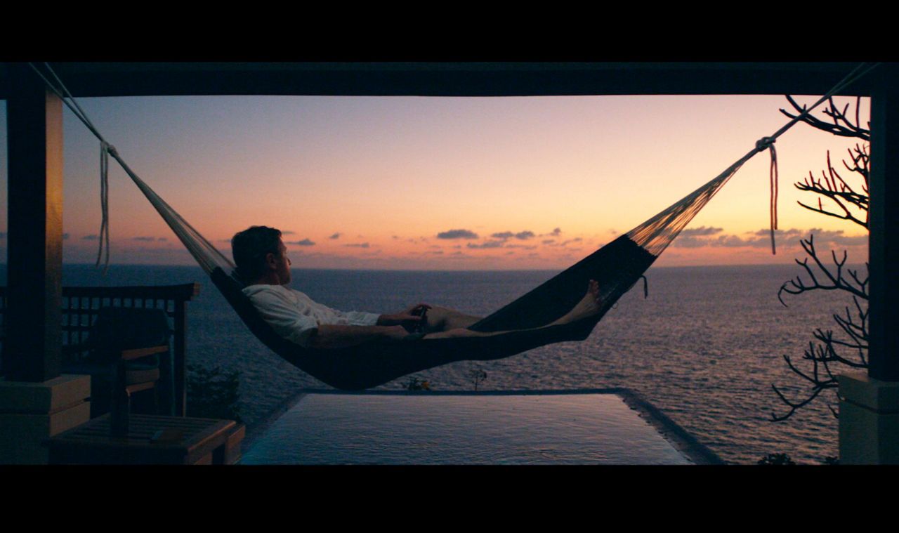 Review: Tim Roth drops out, in paradise, in ‘Sundown’