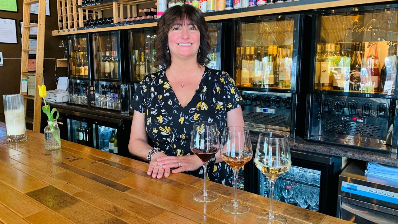 https://s7d2.scene7.com/is/image/TWCNews/Flight_Wine_Bar_owner_Sue_Reuter