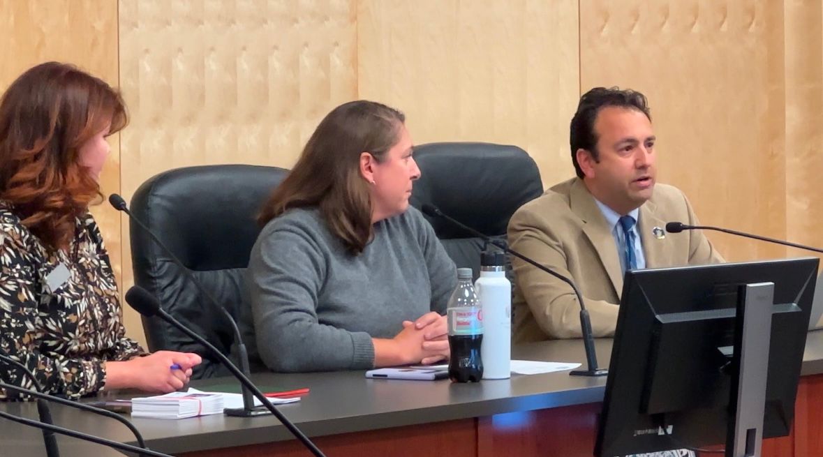 Senate President Mattie Daughtry (D-Brunswick), Brunswick Town Council Chairwoman Abby King and Rep. Dan Ankeles (D-Brunswick) address the public at an August meeting about the PFAS firefighting foam spill. (Spectrum News/Susan Cover)