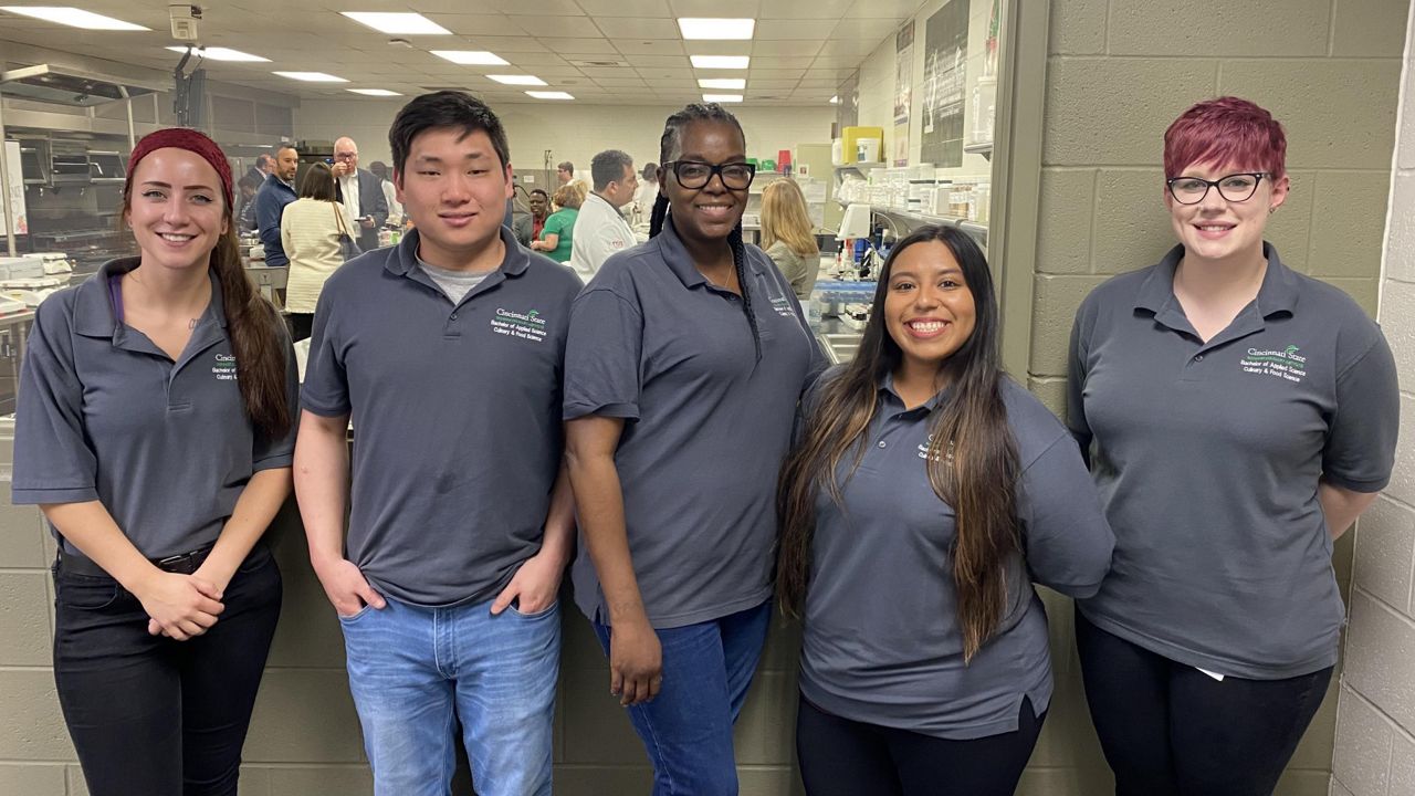 Mayra Tafoya (second from right) is one of 10 members of the first cohort to graduate from Cincinnati State's Culinary and Food Science program. (Spectrum News 1/Casey Weldon)
