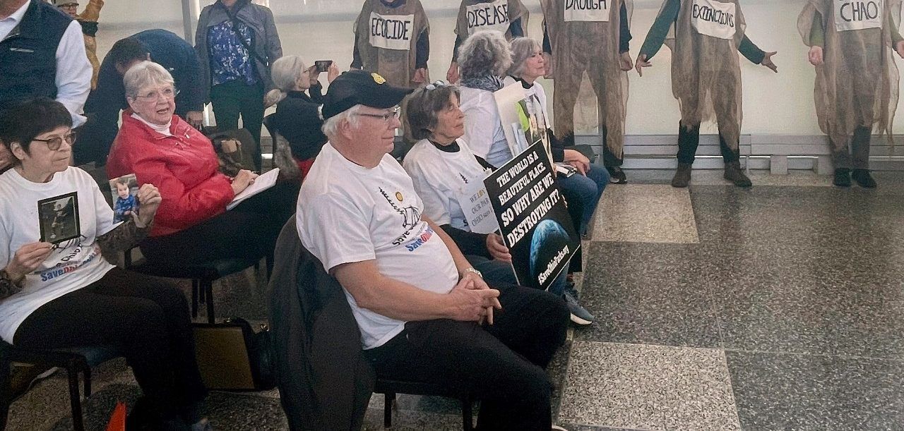 Protesters pack a meeting of the Ohio Oil and Gas Land Management Commission in Columbus, Ohio on Monday, Feb. 26, 2024. The commission awarded bids to frack for oil and under public land Monday, including state parks and designated wildlife areas, to several oil and gas companies. (AP Photo/Samantha Hendrickson)