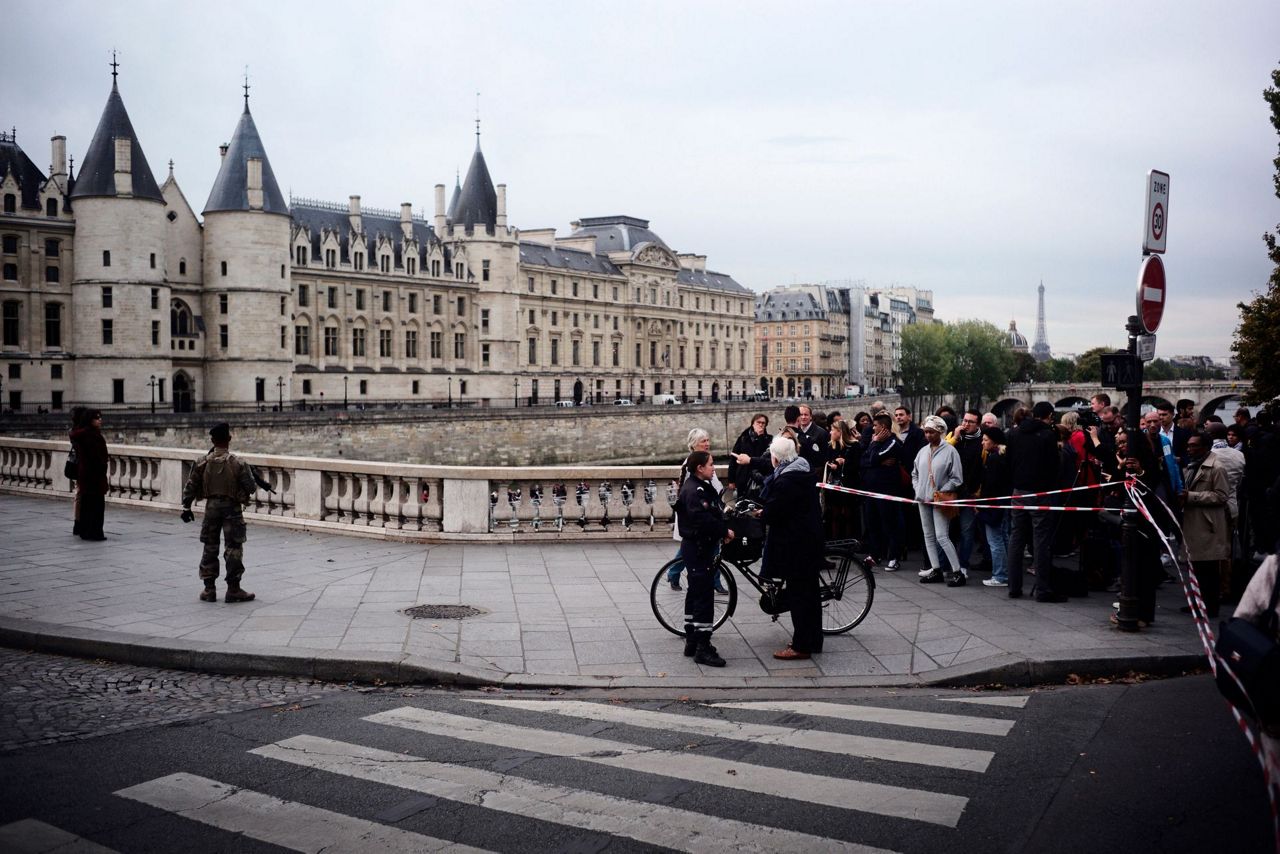 Knife attack at Paris police headquarters injures 2 officers