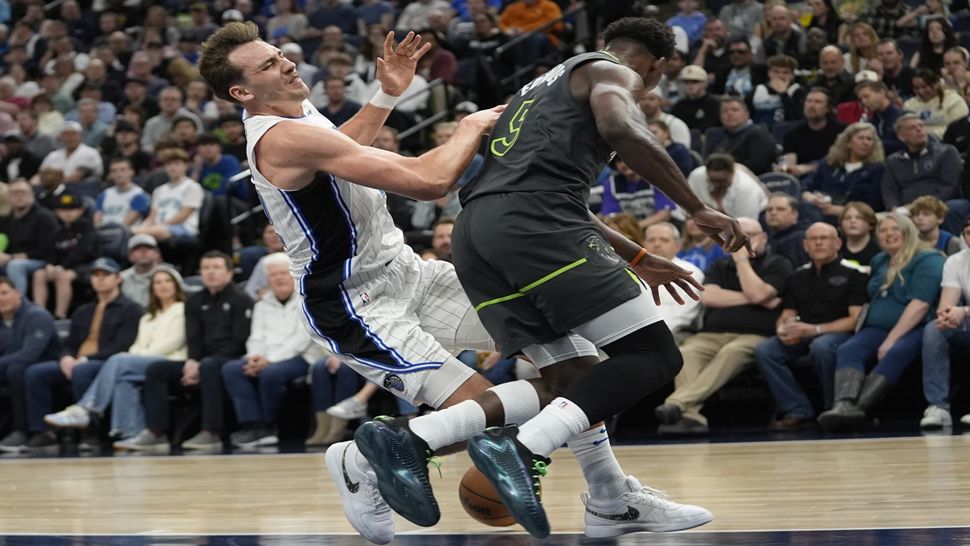 Orlando Magic forward Franz Wagner collides with Minnesota Timberwolves guard Anthony Edwards during the first half on Friday night's game.