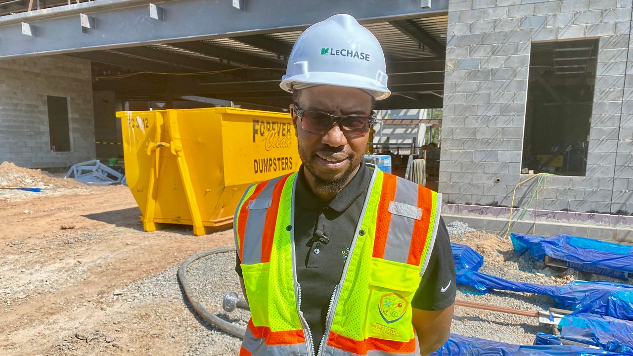 Fred Davis stands in front of one of his projects.