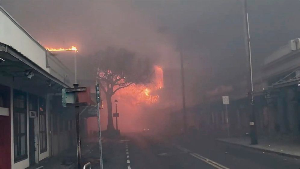 Smoke and flames fill the air from raging wildfires on Front Street in downtown Lahaina, Maui on Tuesday, Aug. 8, 2023. Maui officials say wildfire in the historic town has burned parts of one of the most popular tourist areas in Hawaii. County of Maui spokesperson Mahina Martin said in a phone interview early Wednesday says fire was widespread in Lahaina, including Front Street, an area of the town popular with tourists. (AP Photo/Alan Dickar)