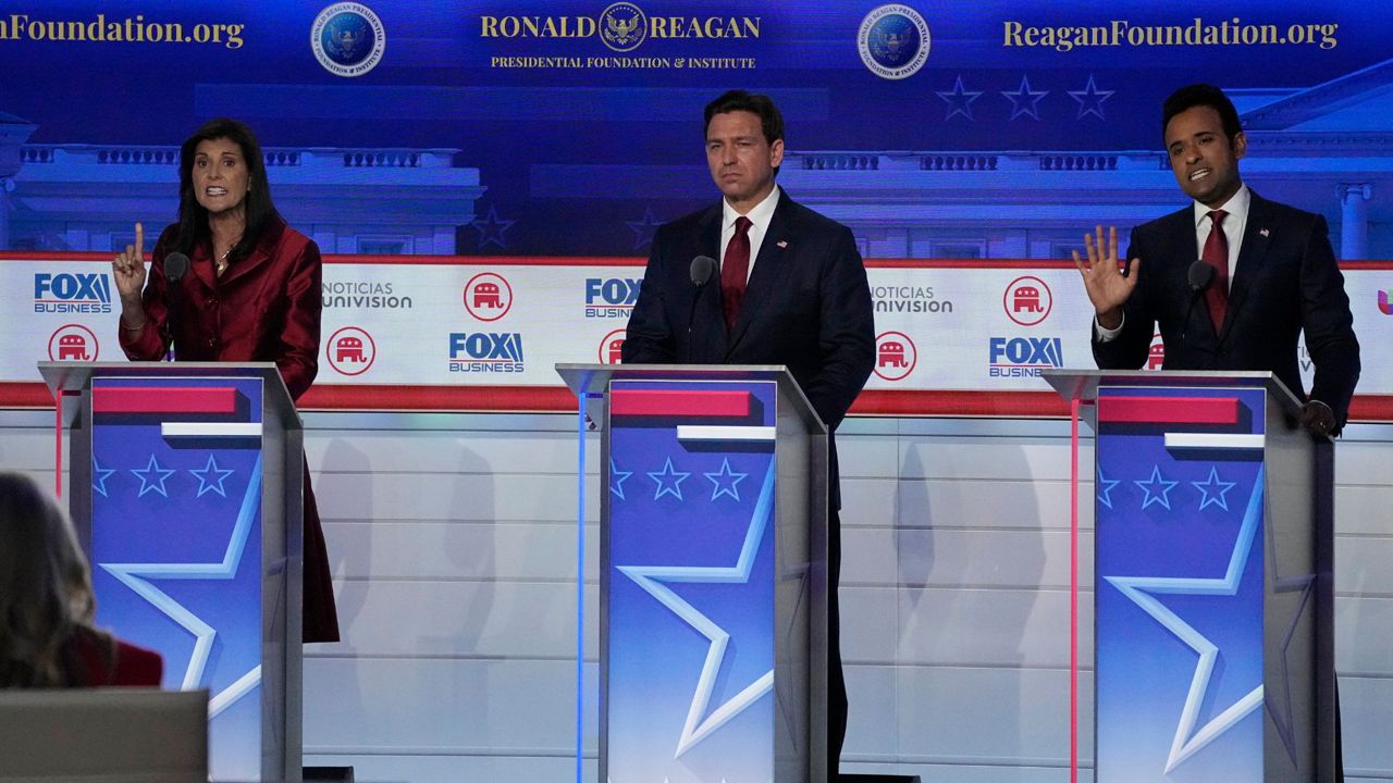 Former U.N. Ambassador Nikki Haley, left, argues a point with businessman Vivek Ramaswamy, right, between Florida Gov. Ron DeSantis, center, during a Republican presidential primary debate hosted by FOX Business Network and Univision, Wednesday, Sept. 27, 2023, at the Ronald Reagan Presidential Library in Simi Valley, Calif. (AP Photo/Mark J. Terrill, File)