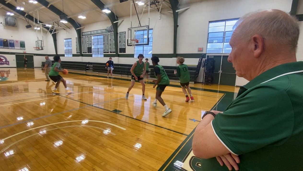 Coach Freddy Johnson watching his team practice for the HAECO Inviational Tournament  (Spectrum News 1/Zyneria Byrd)