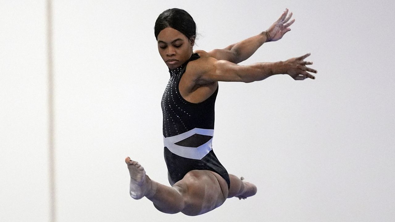 Gabby Douglas competes on the balance beam at the American Classic, in Katy, Texas, April 27, 2024. (AP Photo/David J. Phillip)